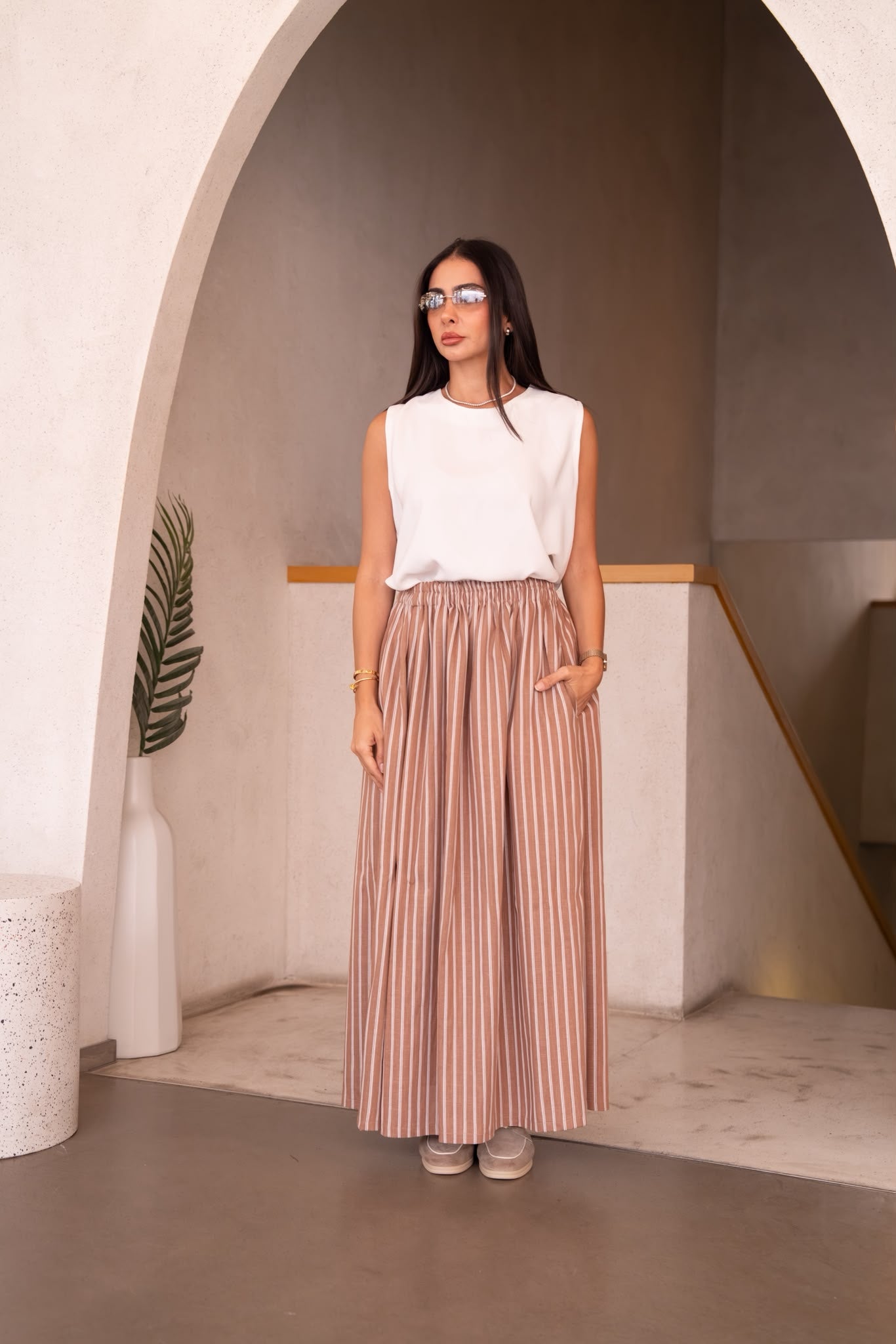 A white blouse and skirt set.C:251