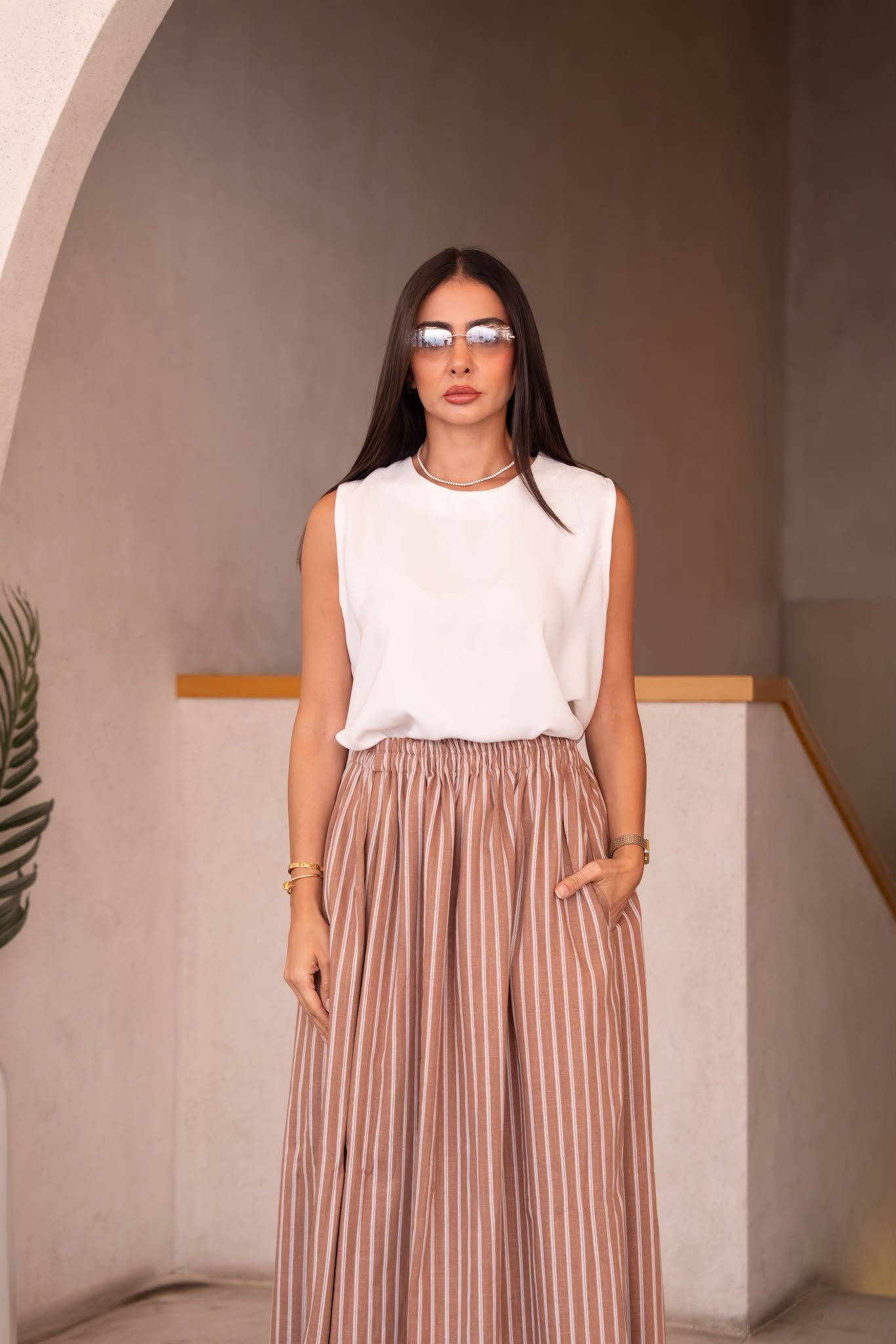 A white blouse and skirt set.C:251