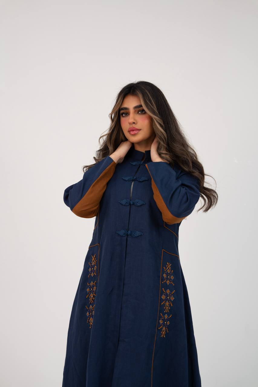 Linen abaya in navy blue with hand-stitched details. C:6766