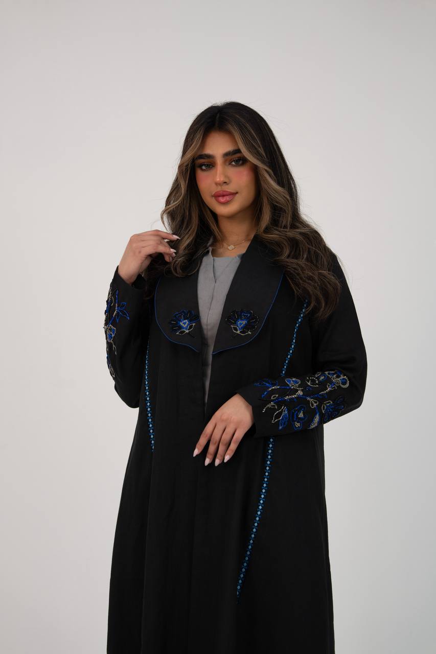 Black linen trench coat with hand embroidery and beading. C:6768