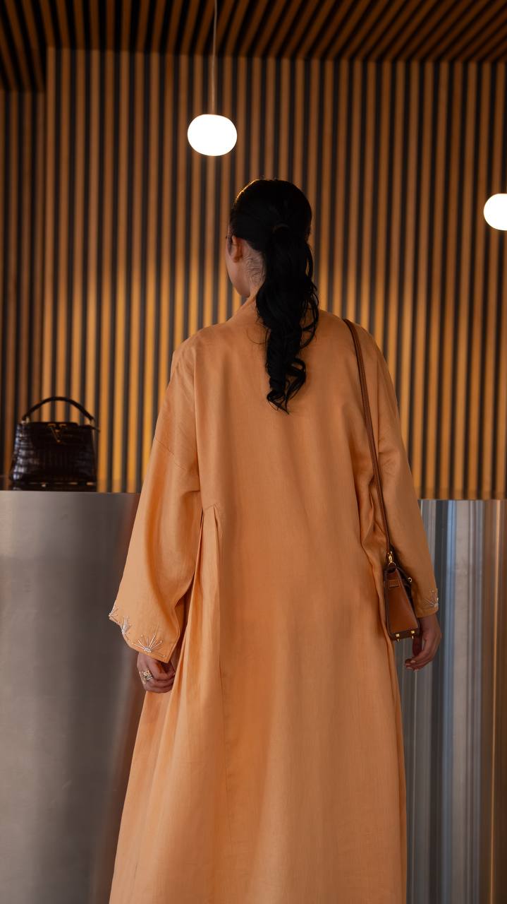 Linen abaya in orange with hand embroidery. C:6790 Oranges