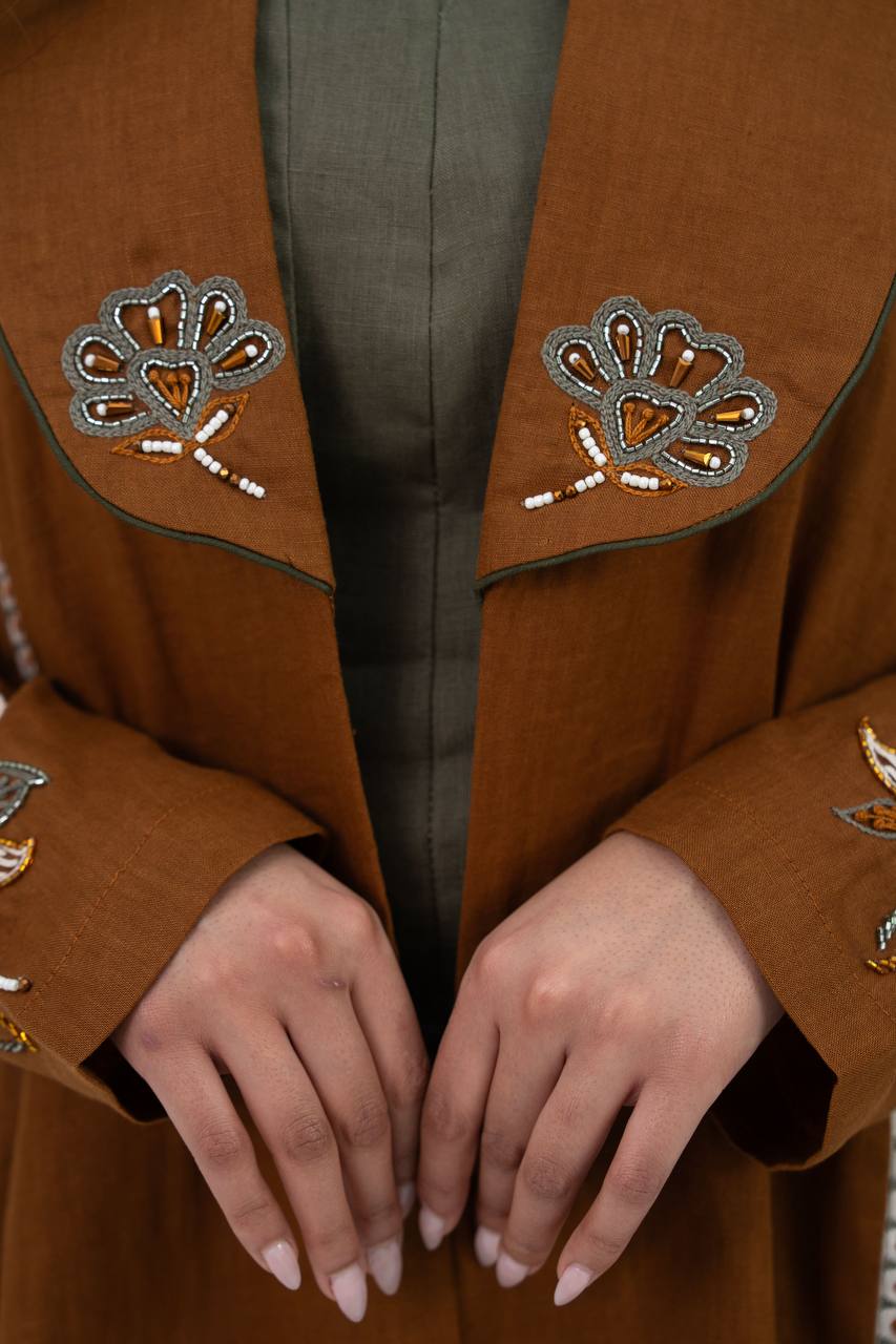 Camel-colored linen trench coat with hand embroidery and beading. C:6768