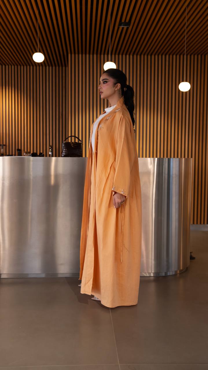 Linen abaya in orange with hand embroidery. C:6790 Oranges