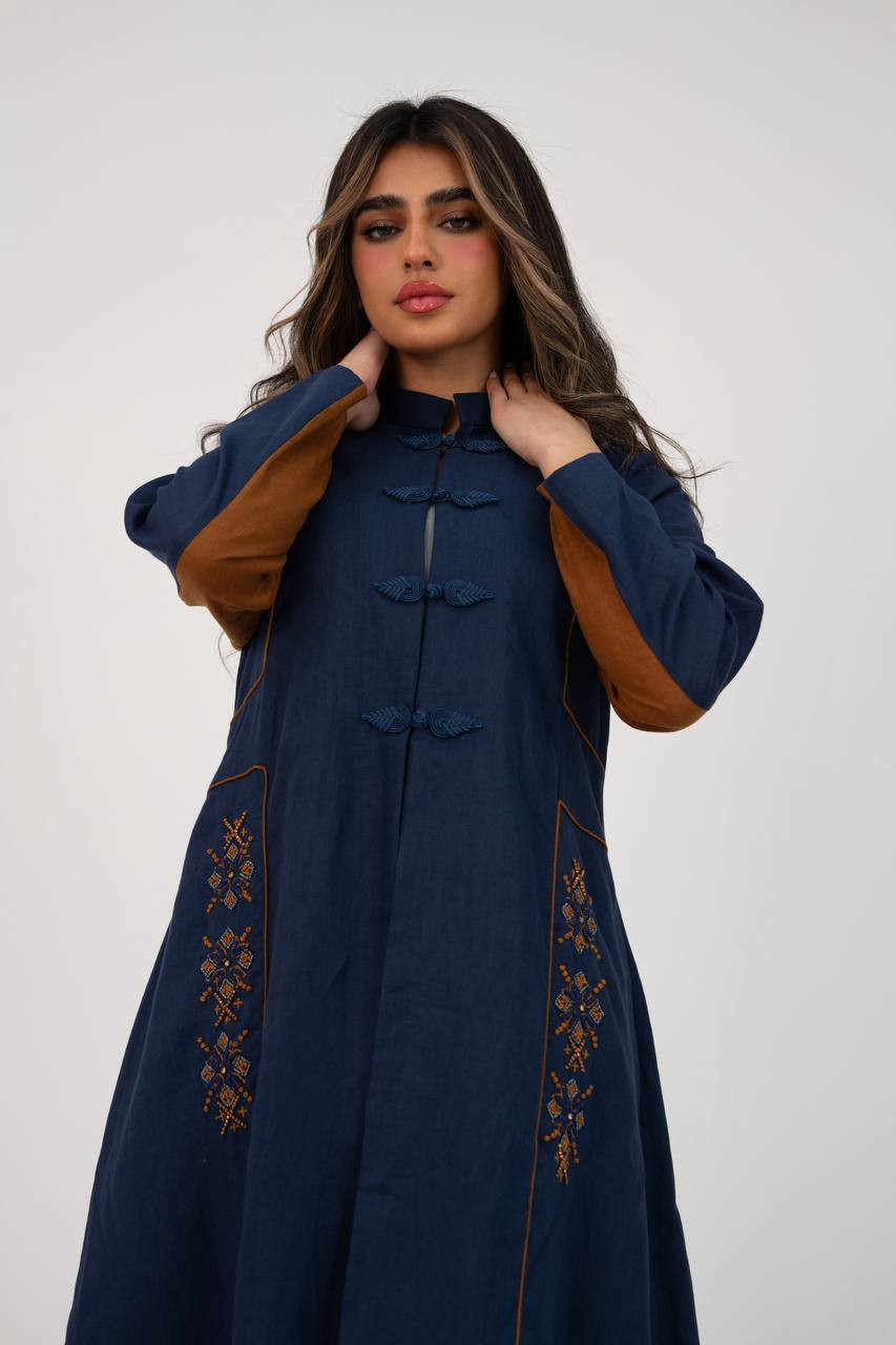 Linen abaya in navy blue with hand-stitched details. C:6766
