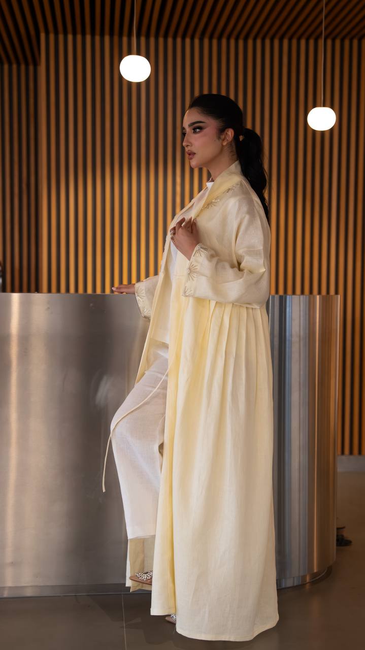 Yellow linen abaya with hand-stitched details. C:6790