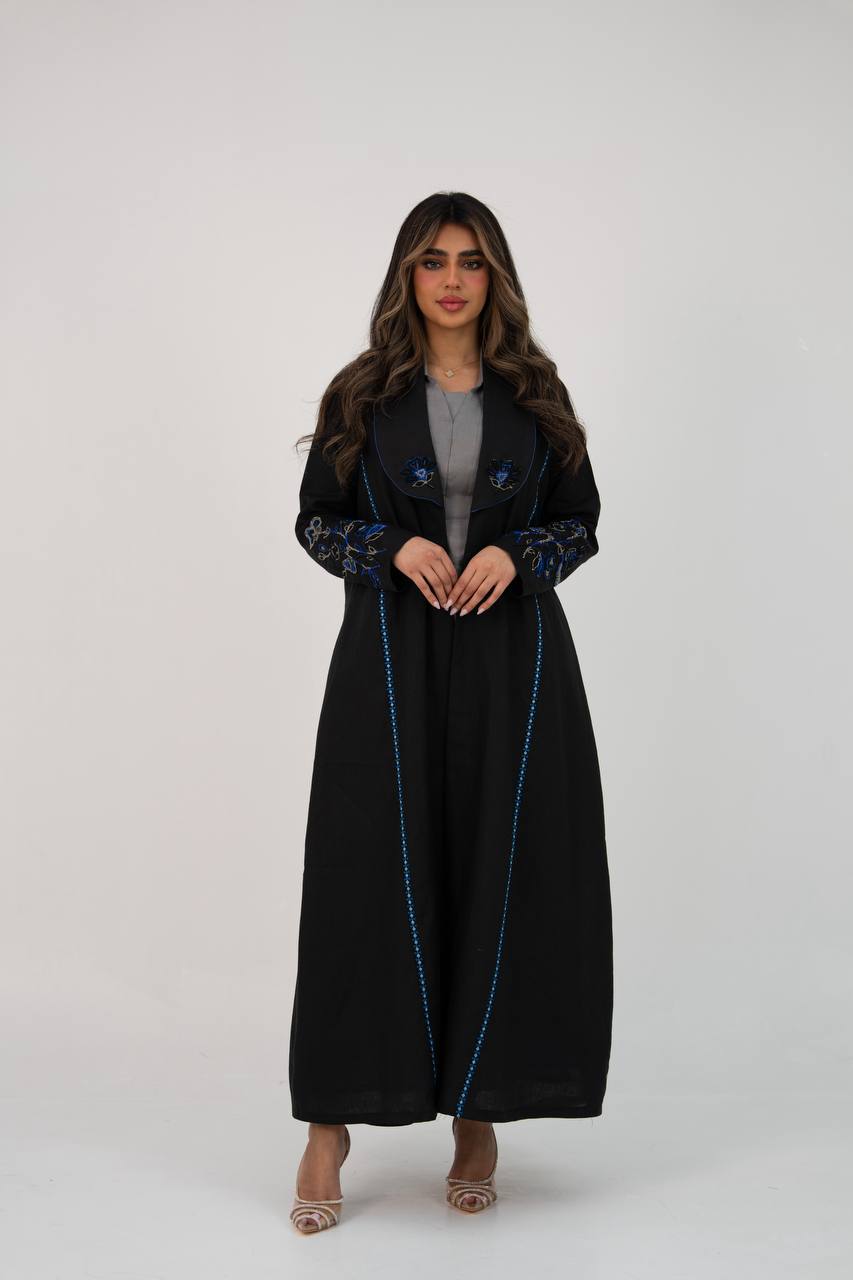 Black linen trench coat with hand embroidery and beading. C:6768