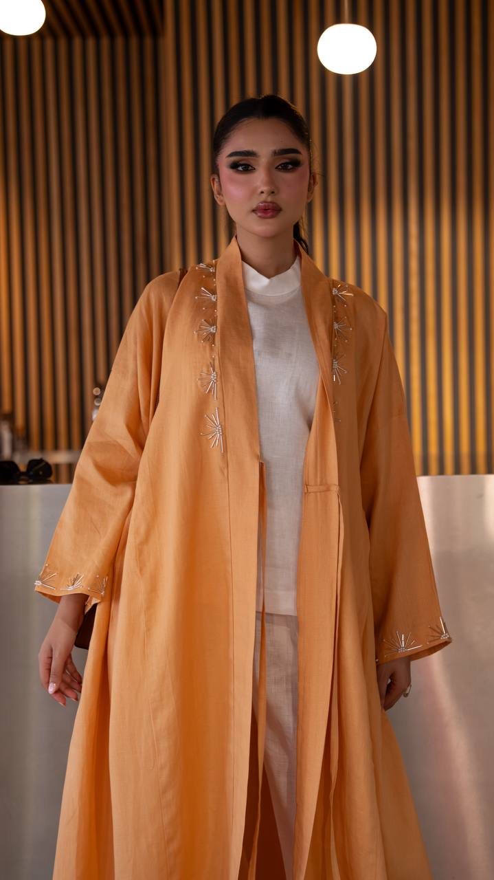 Linen abaya in orange with hand embroidery. C:6790 Oranges