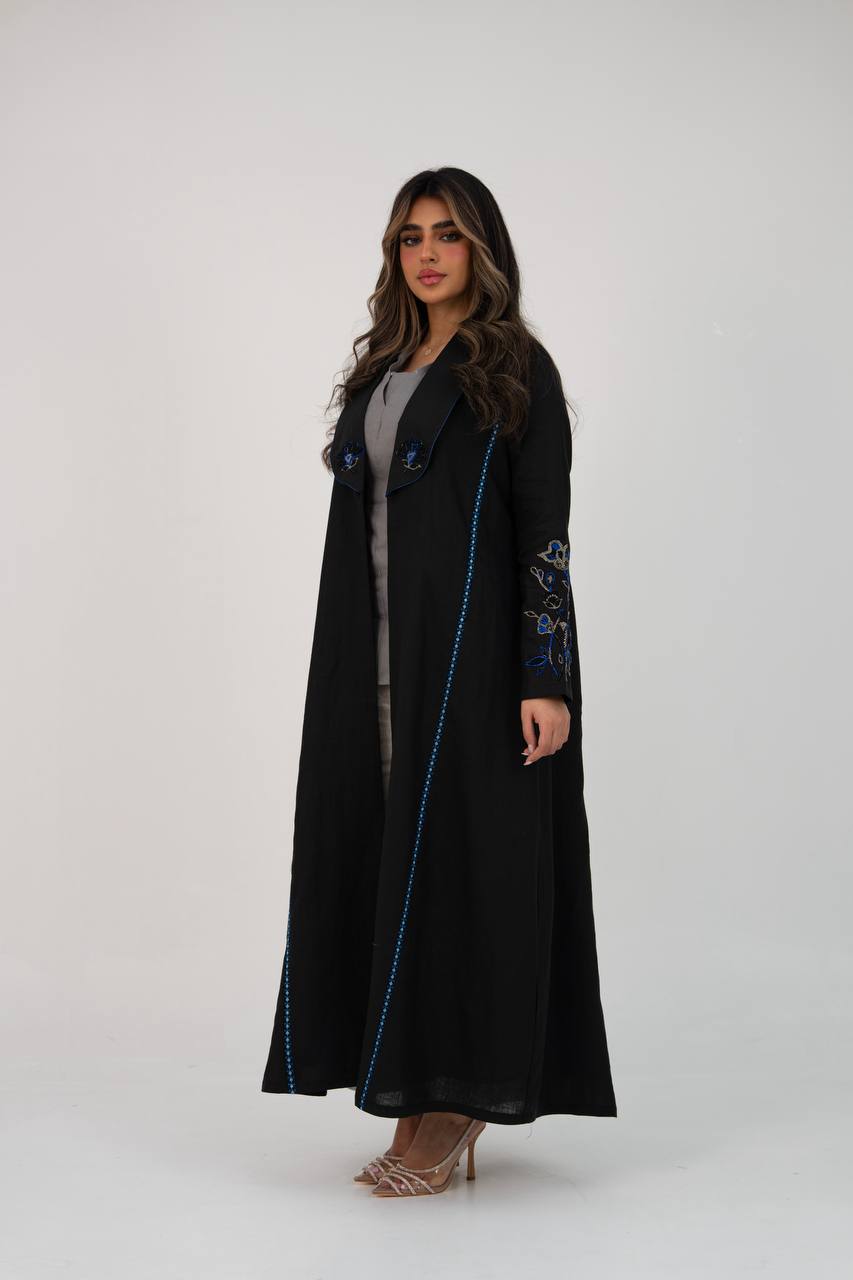 Black linen trench coat with hand embroidery and beading. C:6768