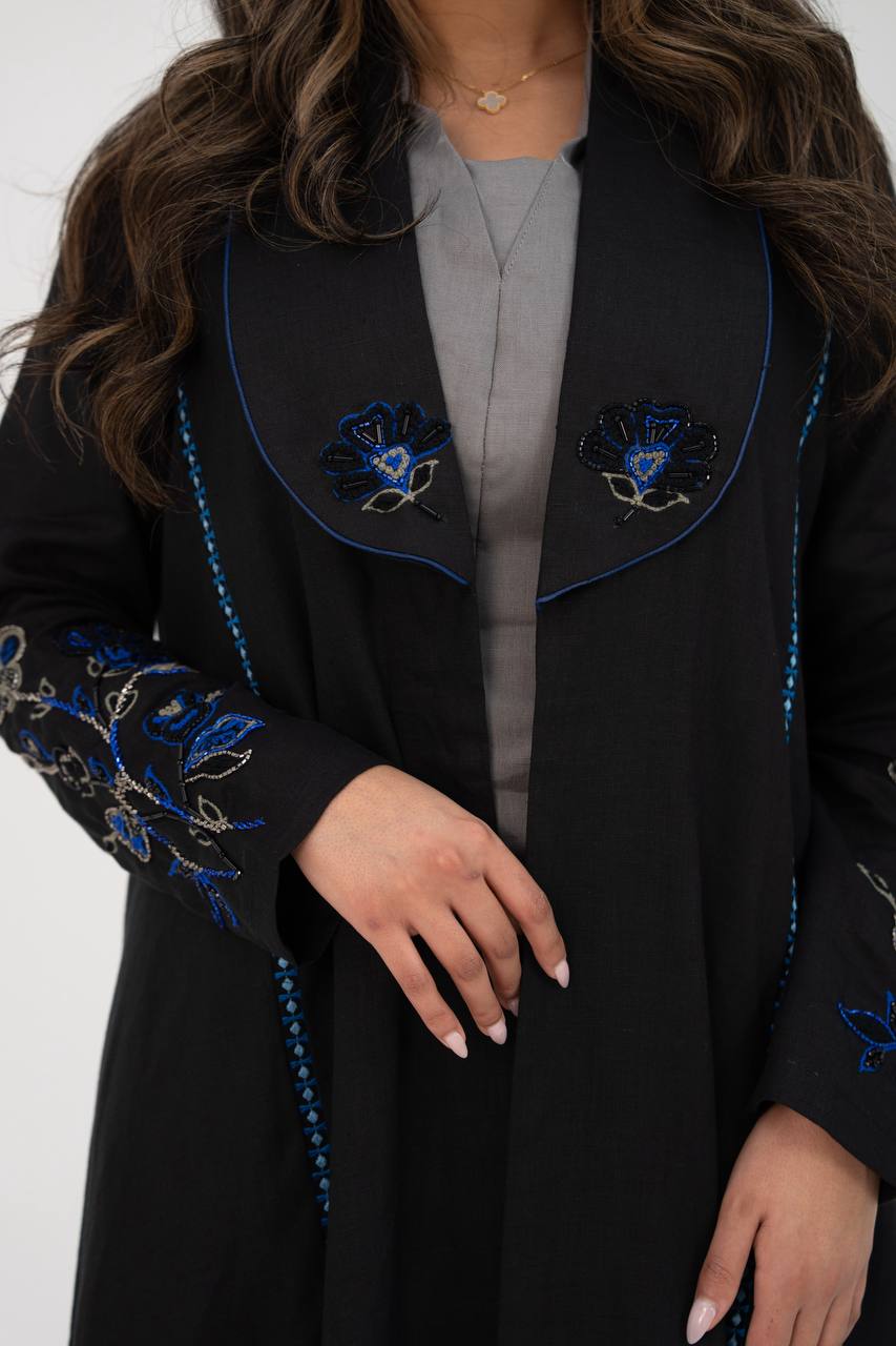 Black linen trench coat with hand embroidery and beading. C:6768