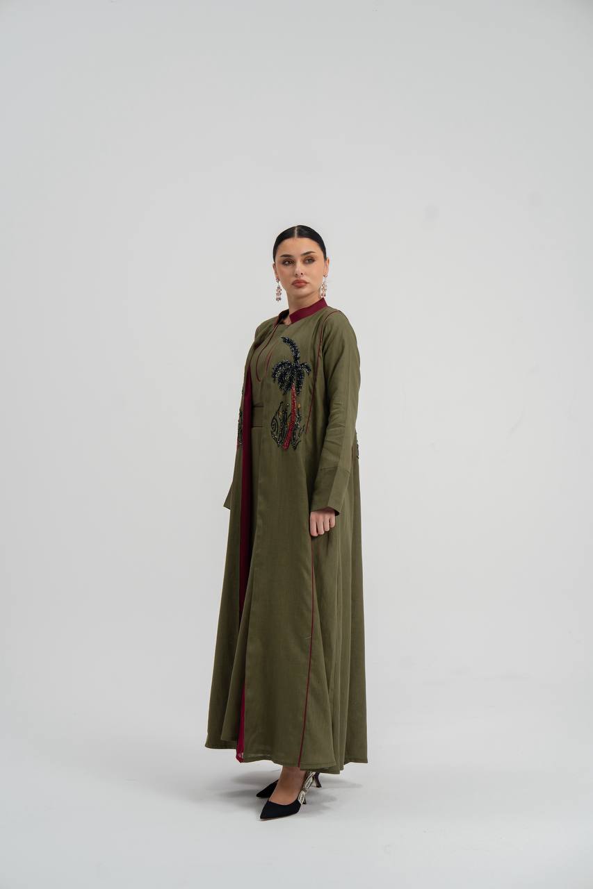 Linen abaya in olive green with hand embroidery. C:6748
