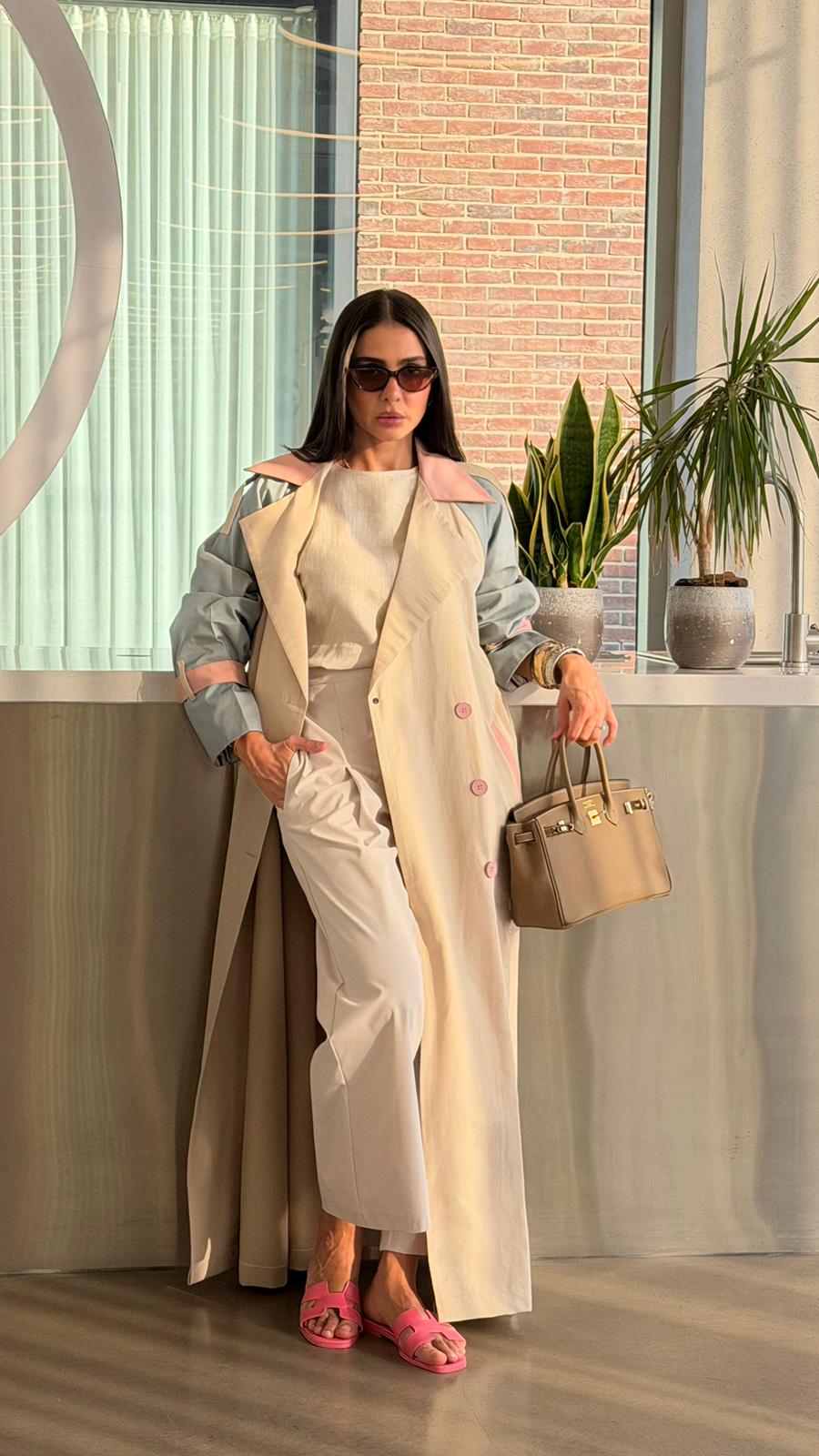 Beige trench coat with sky blue accents.C:6815