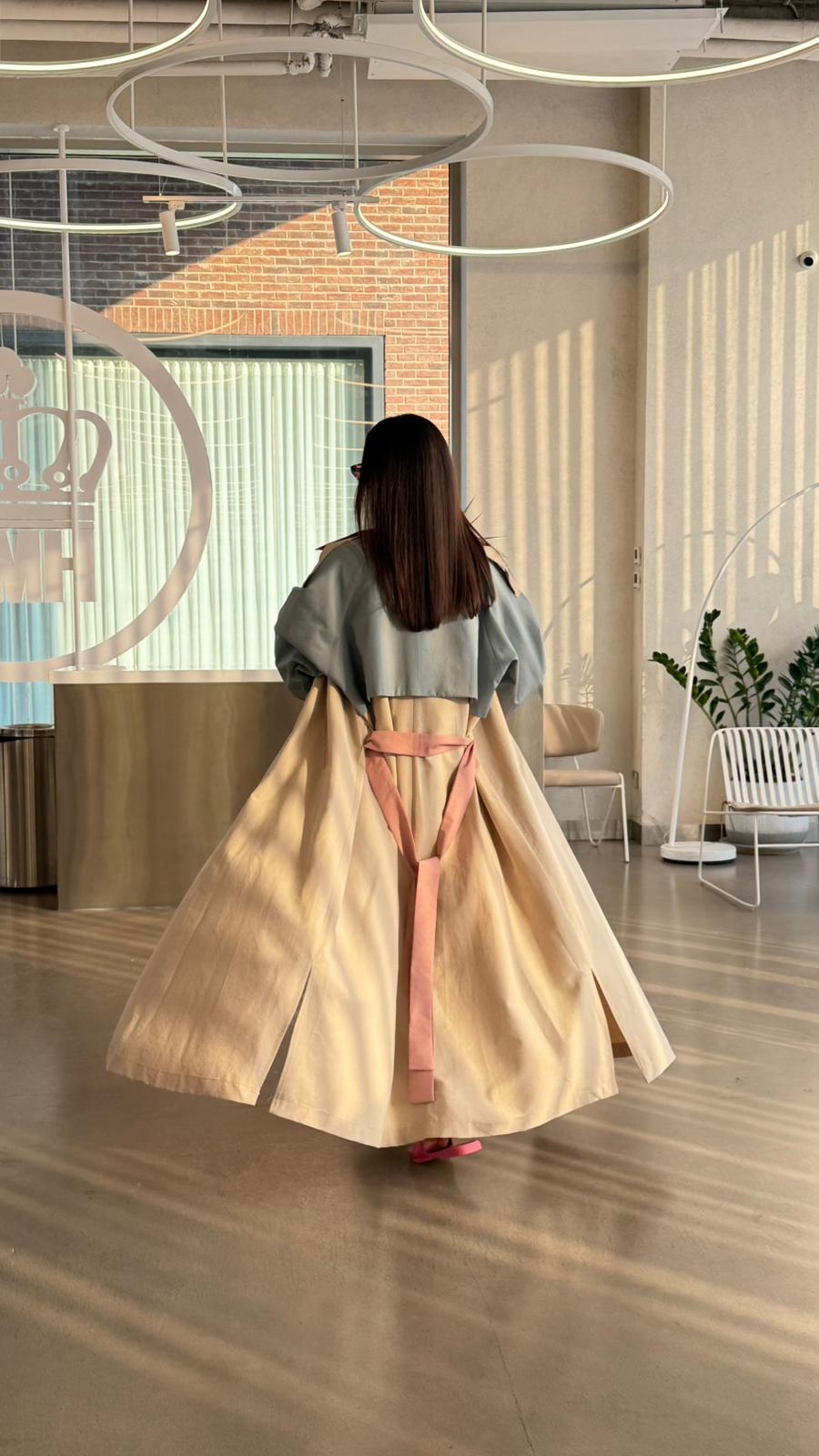 Beige trench coat with sky blue accents.C:6815