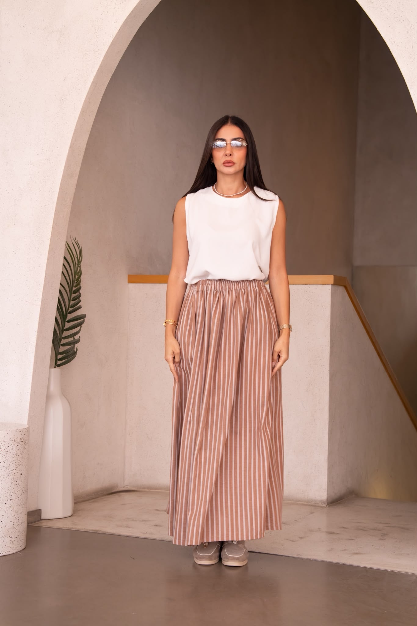 A white blouse and skirt set.C:251