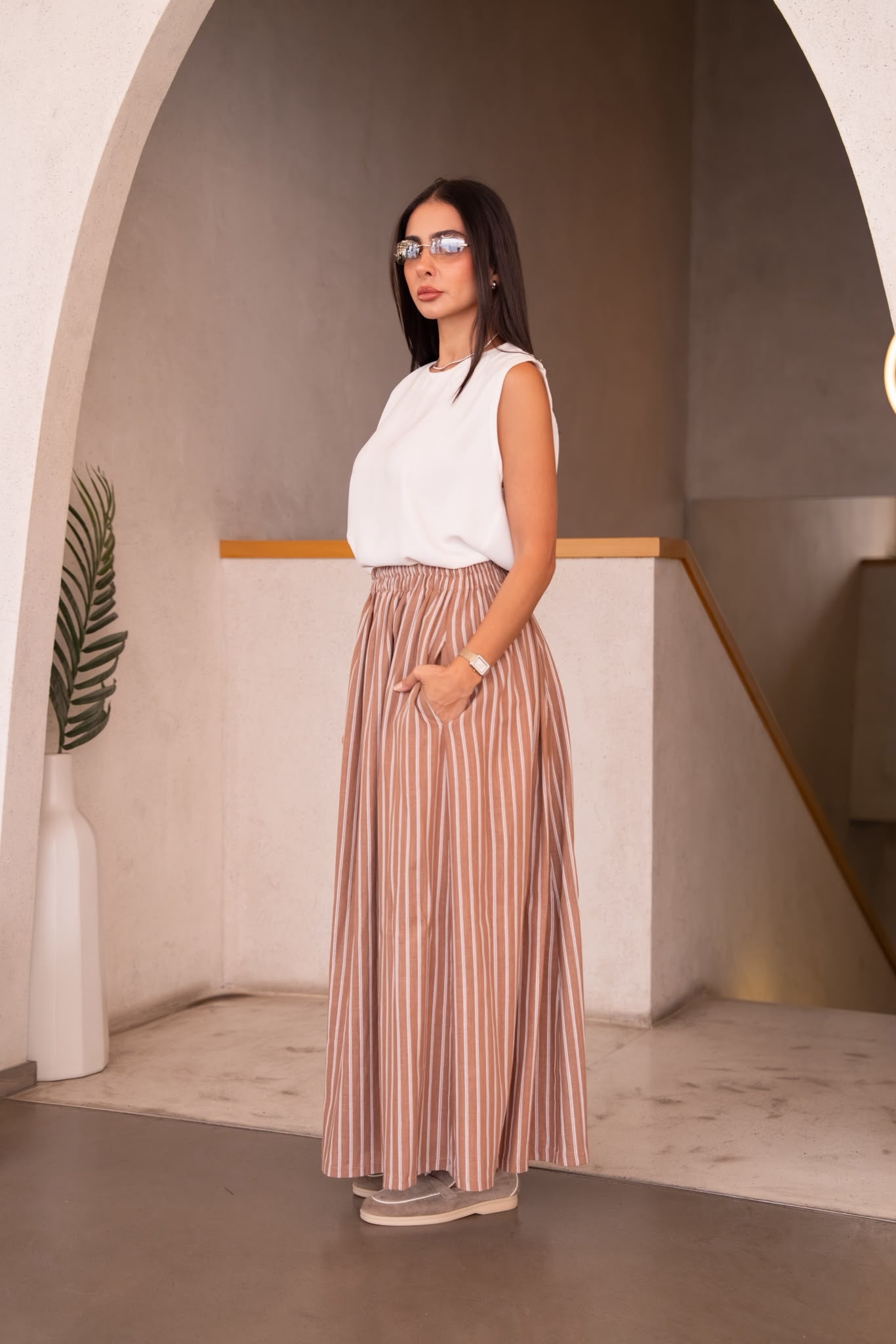 A white blouse and skirt set.C:251