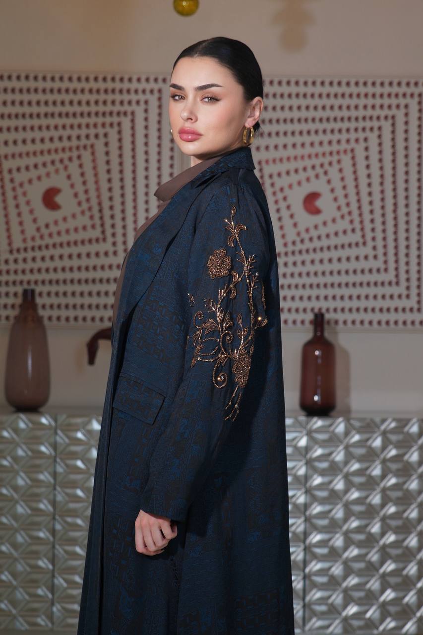 A navy blue jacquard silk blazer abaya with hand-stitched details.C:6754