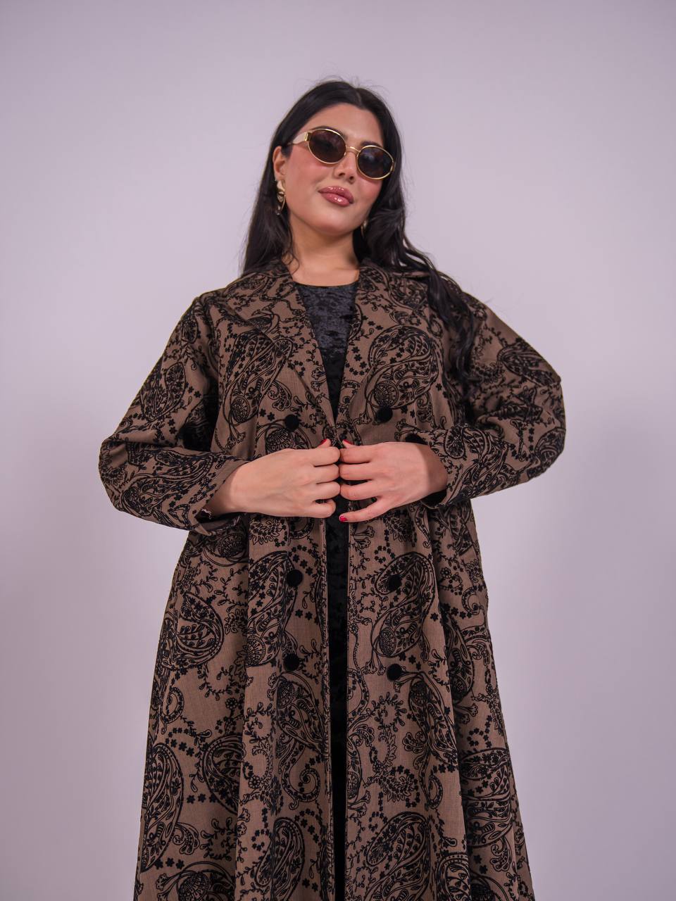 A brown abaya made of crepe fabric with a velvet print.C:6732
