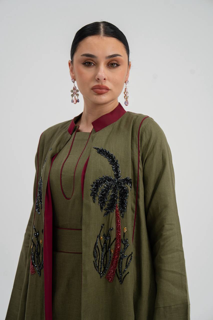 Linen abaya in olive green with hand embroidery. C:6748