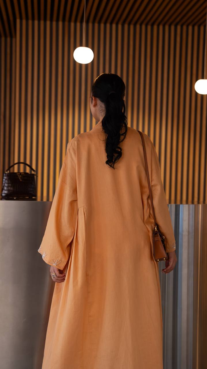 Linen abaya in orange with hand embroidery. C:6790 Oranges