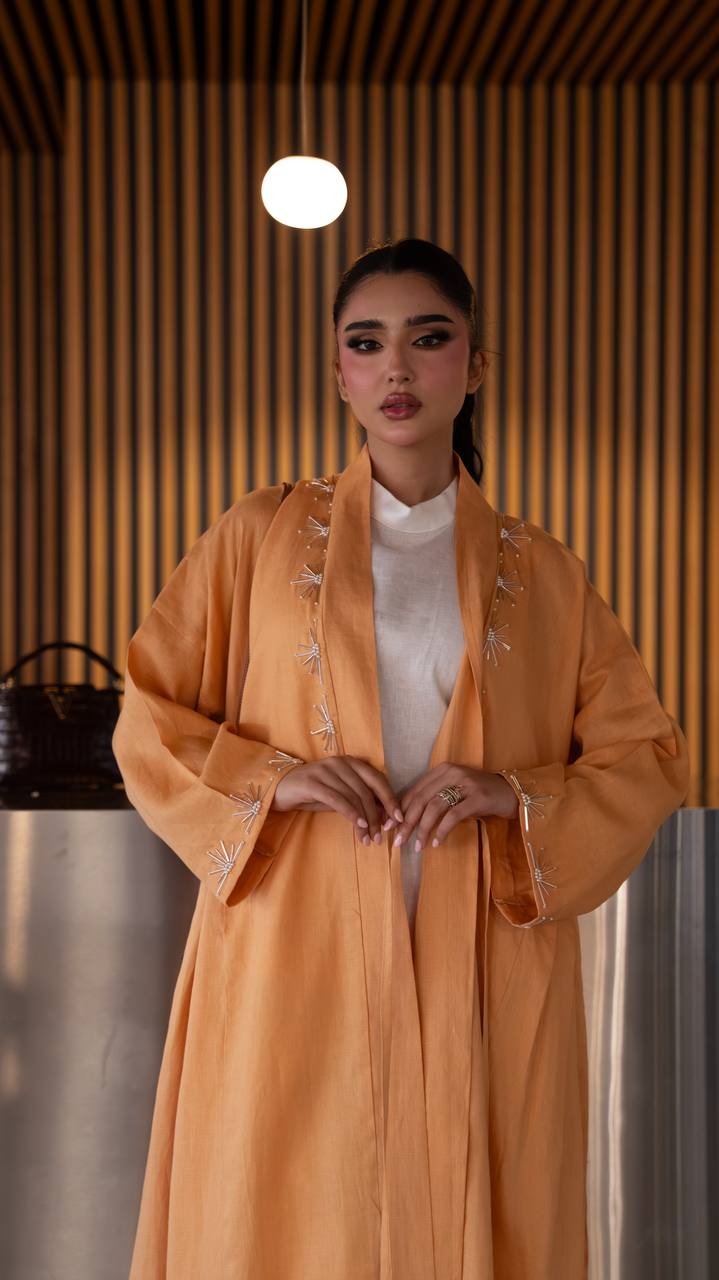 Linen abaya in orange with hand embroidery. C:6790 Oranges