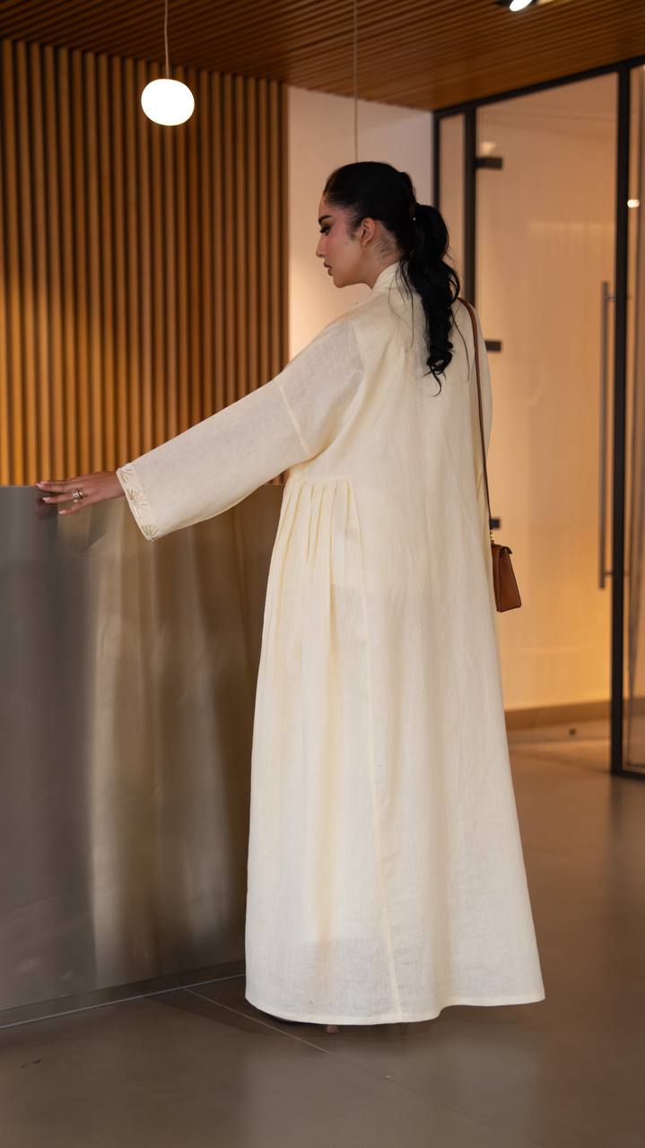 Yellow linen abaya with hand-stitched details. C:6790