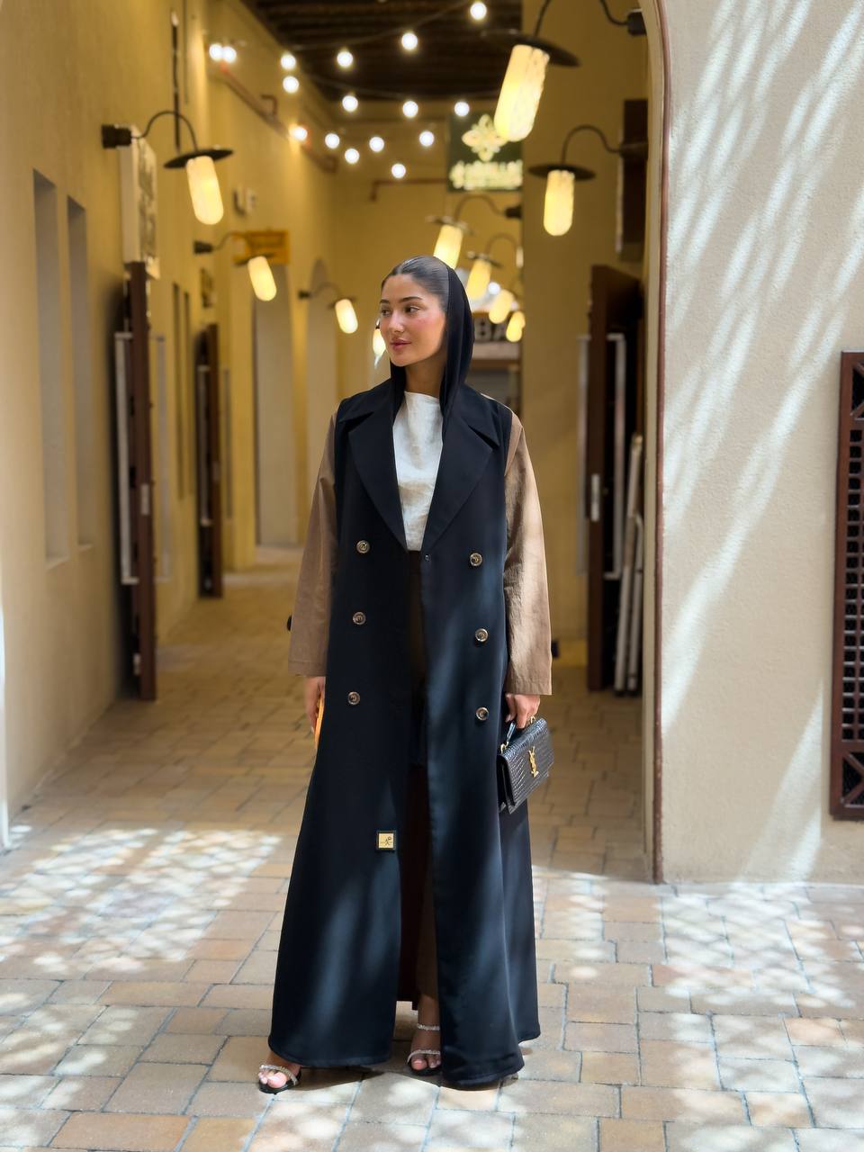 Black crepe blazer abaya in the front and a camel-colored trench coat in the back. C:6681