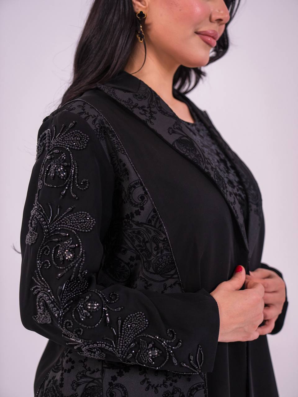 Crepe blazer abaya with black printed crepe and hand-stitched details.C:6733