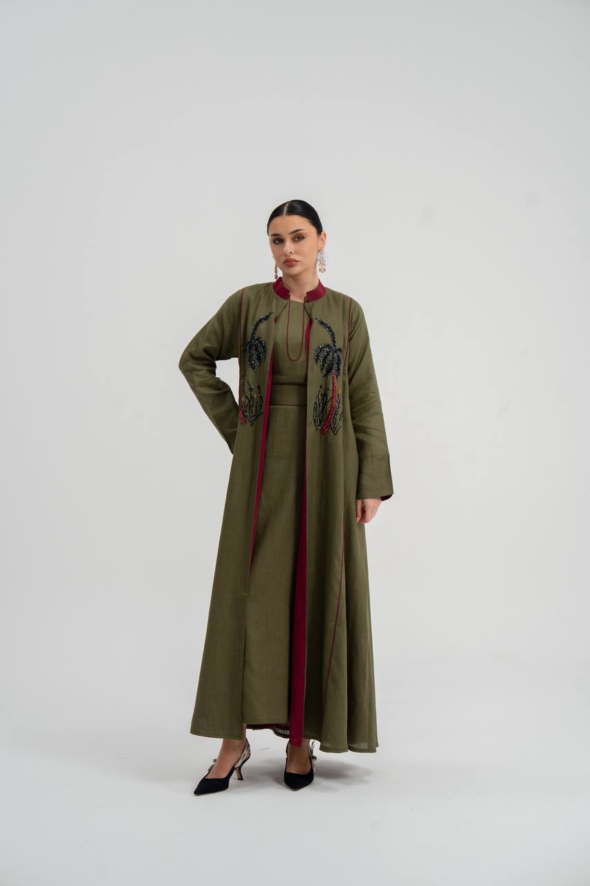 Linen abaya in olive green with hand embroidery. C:6748