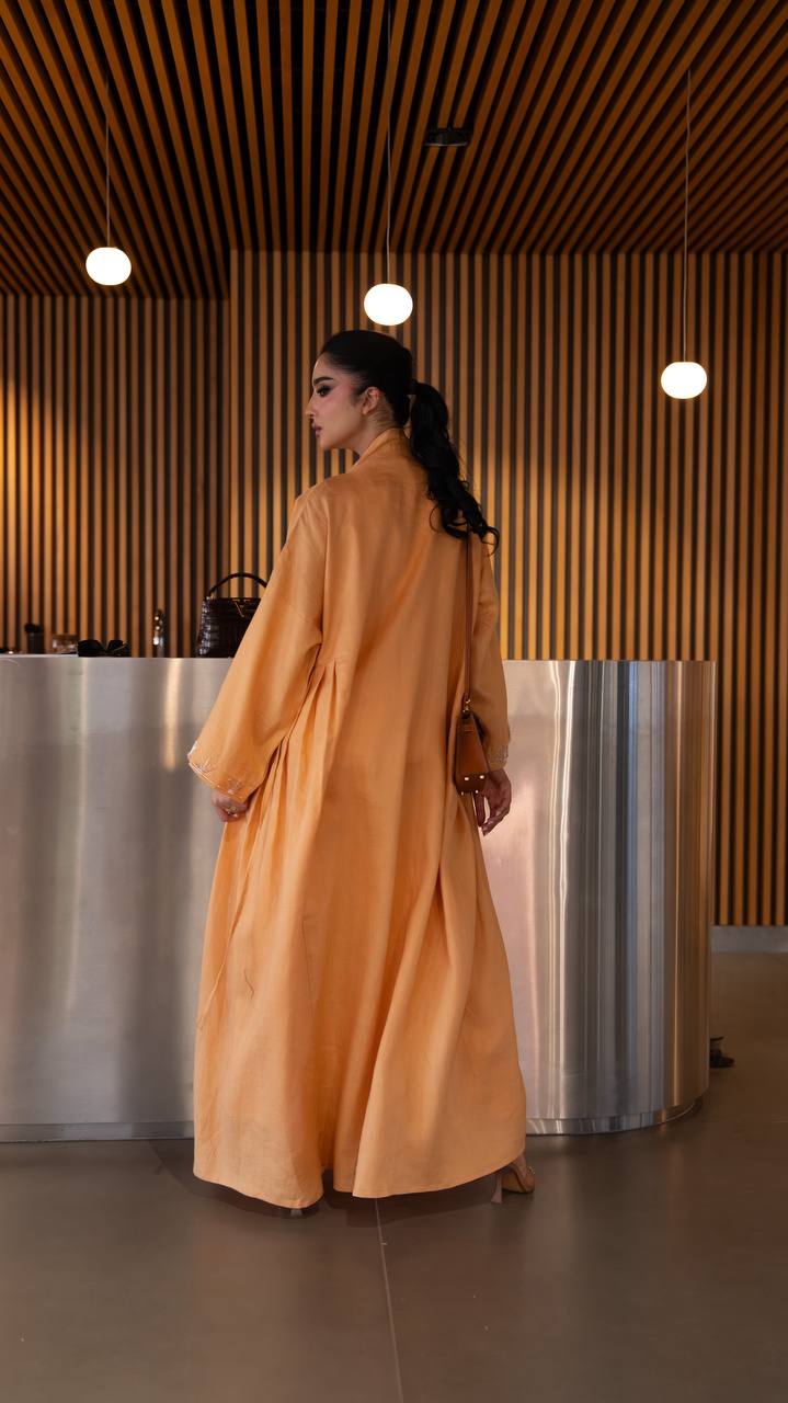 Linen abaya in orange with hand embroidery. C:6790 Oranges