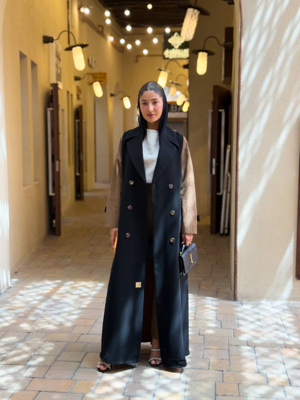 Black crepe blazer abaya in the front and a camel-colored trench coat in the back. C:6681