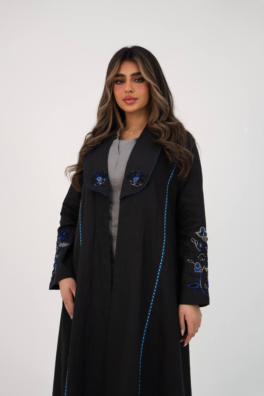 Black linen trench coat with hand embroidery and beading. C:6768