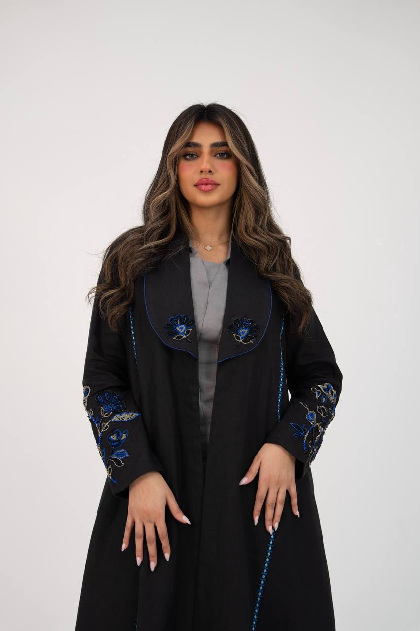 Black linen trench coat with hand embroidery and beading. C:6768